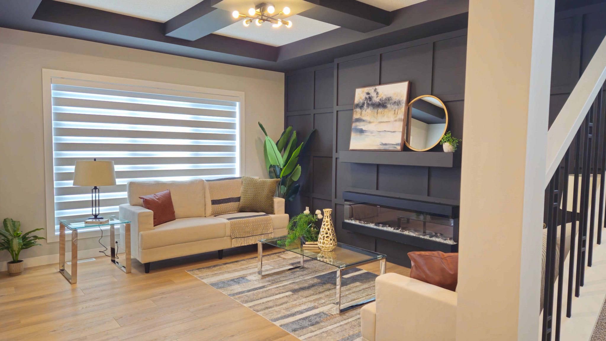 living room with black accent wall and white sofas. Edmonton